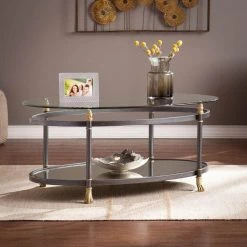 Dorothy 42 in. Dark Gray/Silver/Gold Large Oval Glass Coffee Table with Shelf by Southern Enterprises -Southern Enterprises Sales dark gray finish with silver distressing and gold accents southern enterprises coffee tables hd865003 31 1000